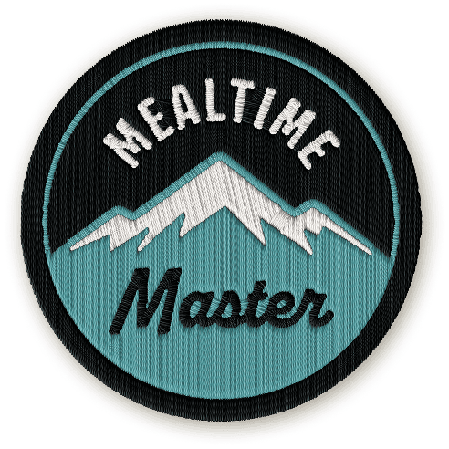 The Mealtime Master badge depicting a blue snow-capped mountain