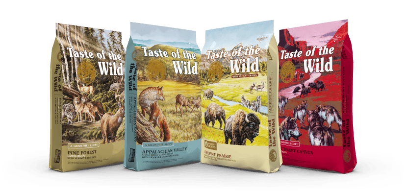 Four different bags of Taste of the Wild food lined up next to each other.
