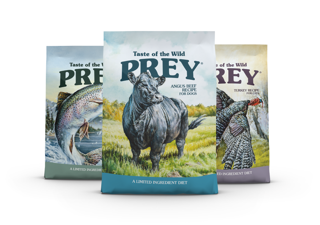 A bag of Taste of the Wild Prey Angus Beef recipe in front of a bag of Taste of the Wild Prey Trout recipe and a bag of Taste of the Wild Prey Turkey recipe.