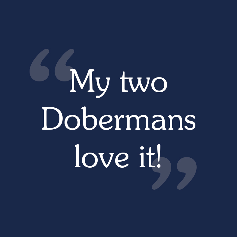 A consumer review that reads, 'My two Dobermans love it'.